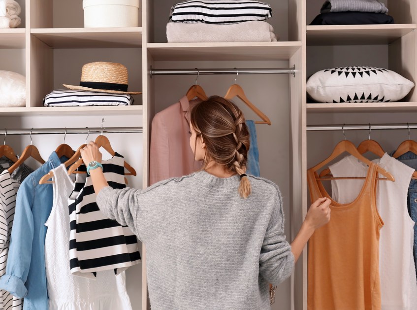 Woman in walk in closet | Top Shelf Closets